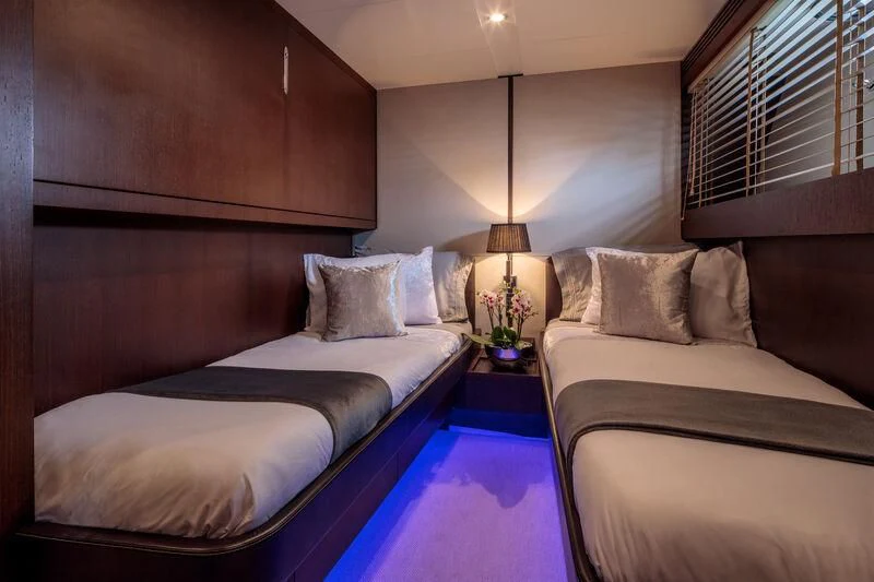 a room with two beds aboard MIRAVAL Yacht for Charter