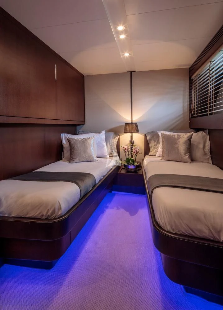 a couple of beds in a hotel room aboard MIRAVAL Yacht for Charter
