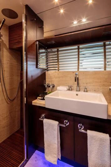 a bathroom with a sink and a shower aboard MIRAVAL Yacht for Charter