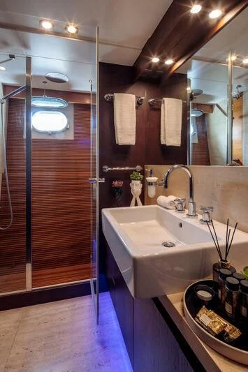 a bathroom with a shower unit and sink aboard MIRAVAL Yacht for Charter