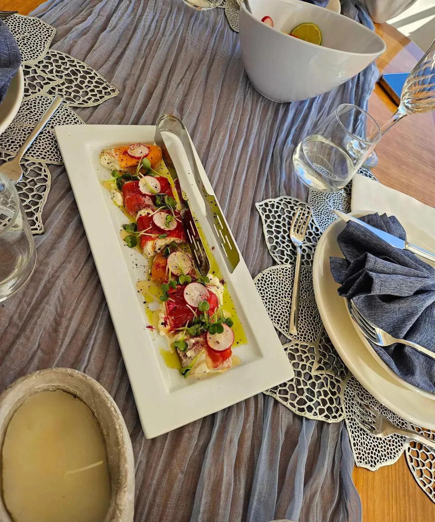 a plate of sushi on a table aboard MIRAVAL Yacht for Charter