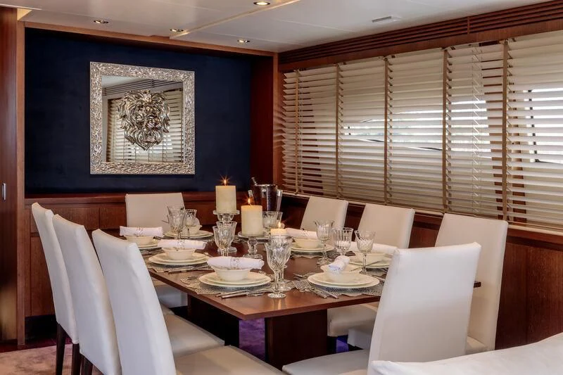a dining room with a table set aboard MIRAVAL Yacht for Charter