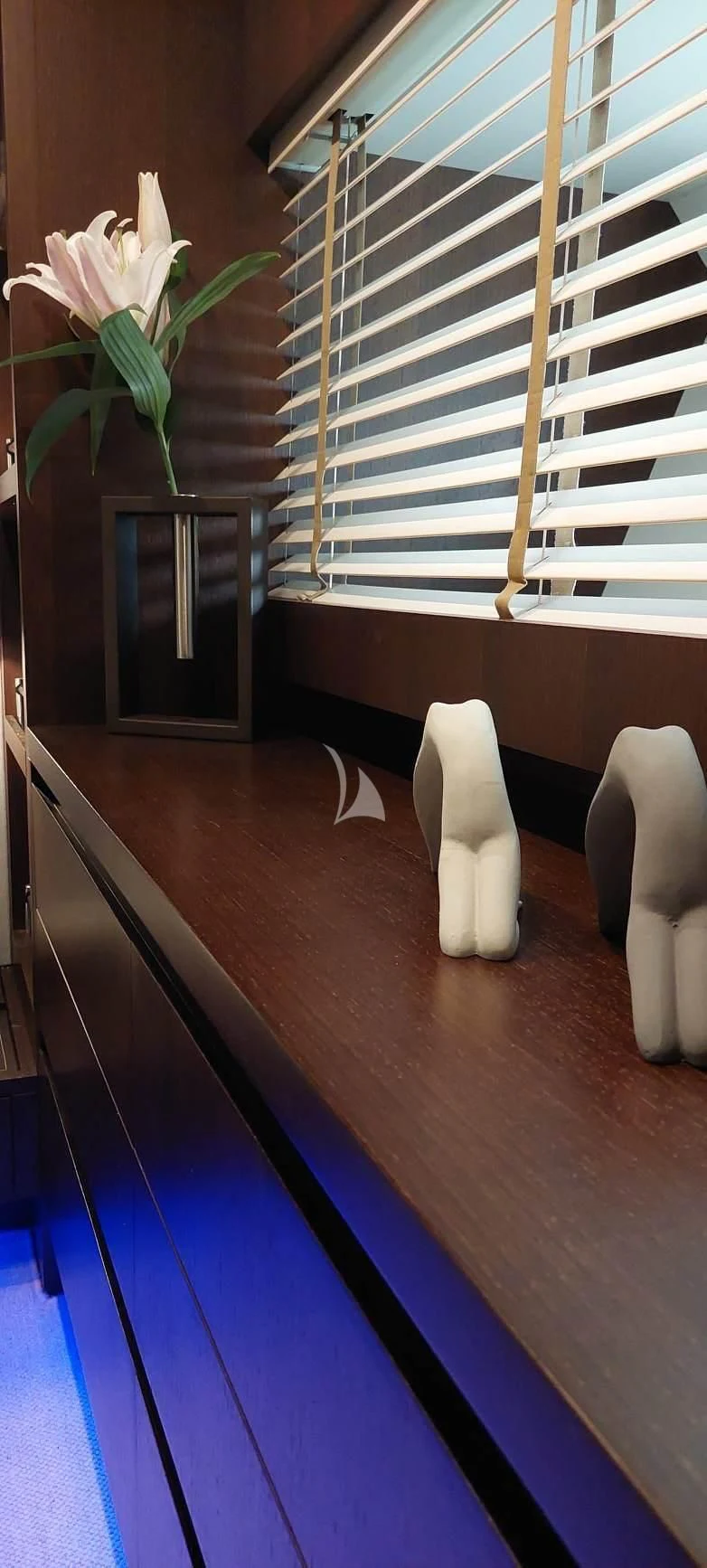 a white flower on a table aboard MIRAVAL Yacht for Charter