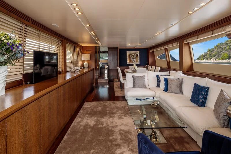 a living room with a large sofa aboard MIRAVAL Yacht for Charter