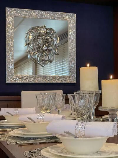 a table with plates and glasses aboard MIRAVAL Yacht for Charter
