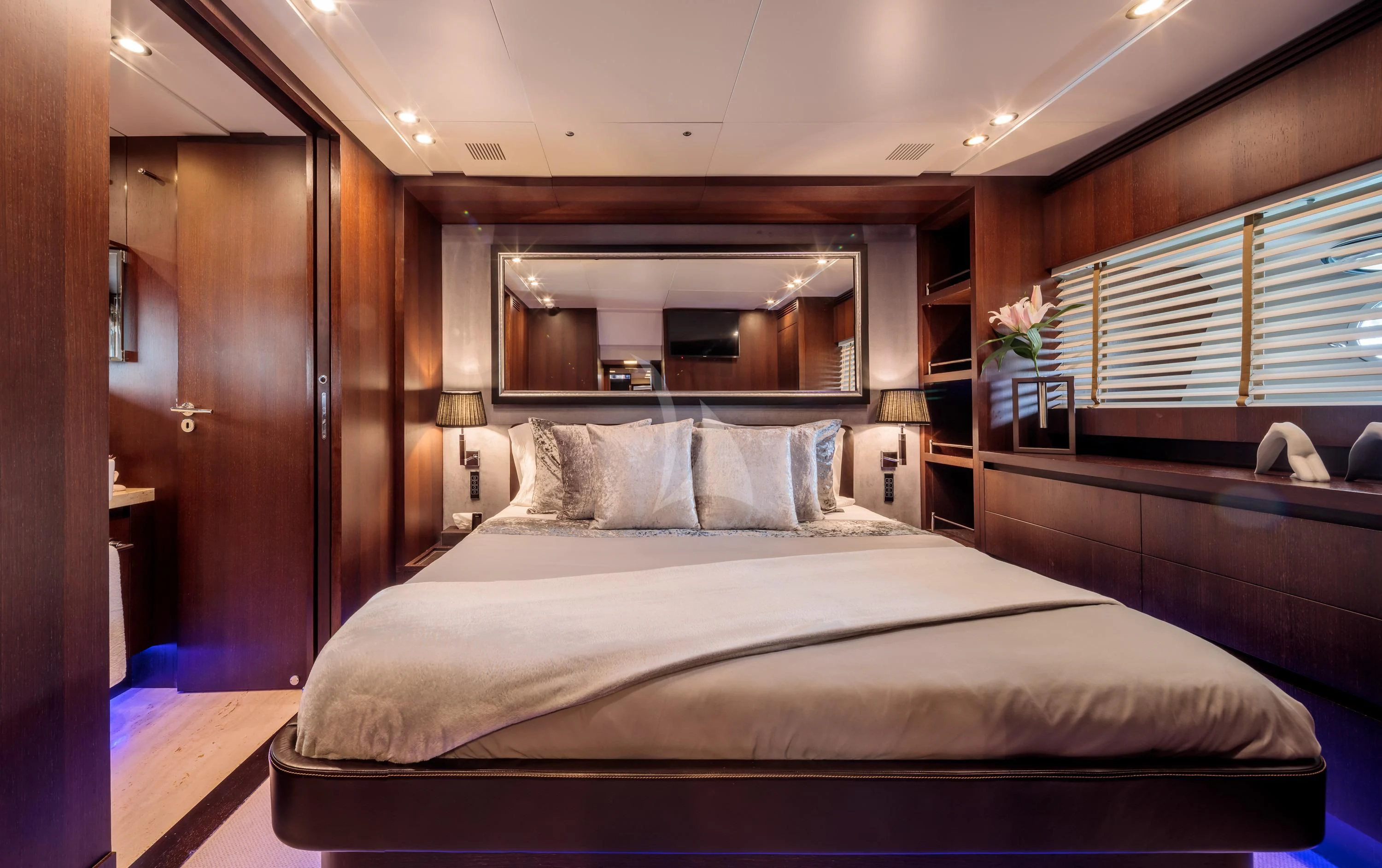 a bed with white sheets aboard MIRAVAL Yacht for Charter
