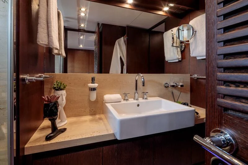 a bathroom with a large mirror aboard MIRAVAL Yacht for Charter