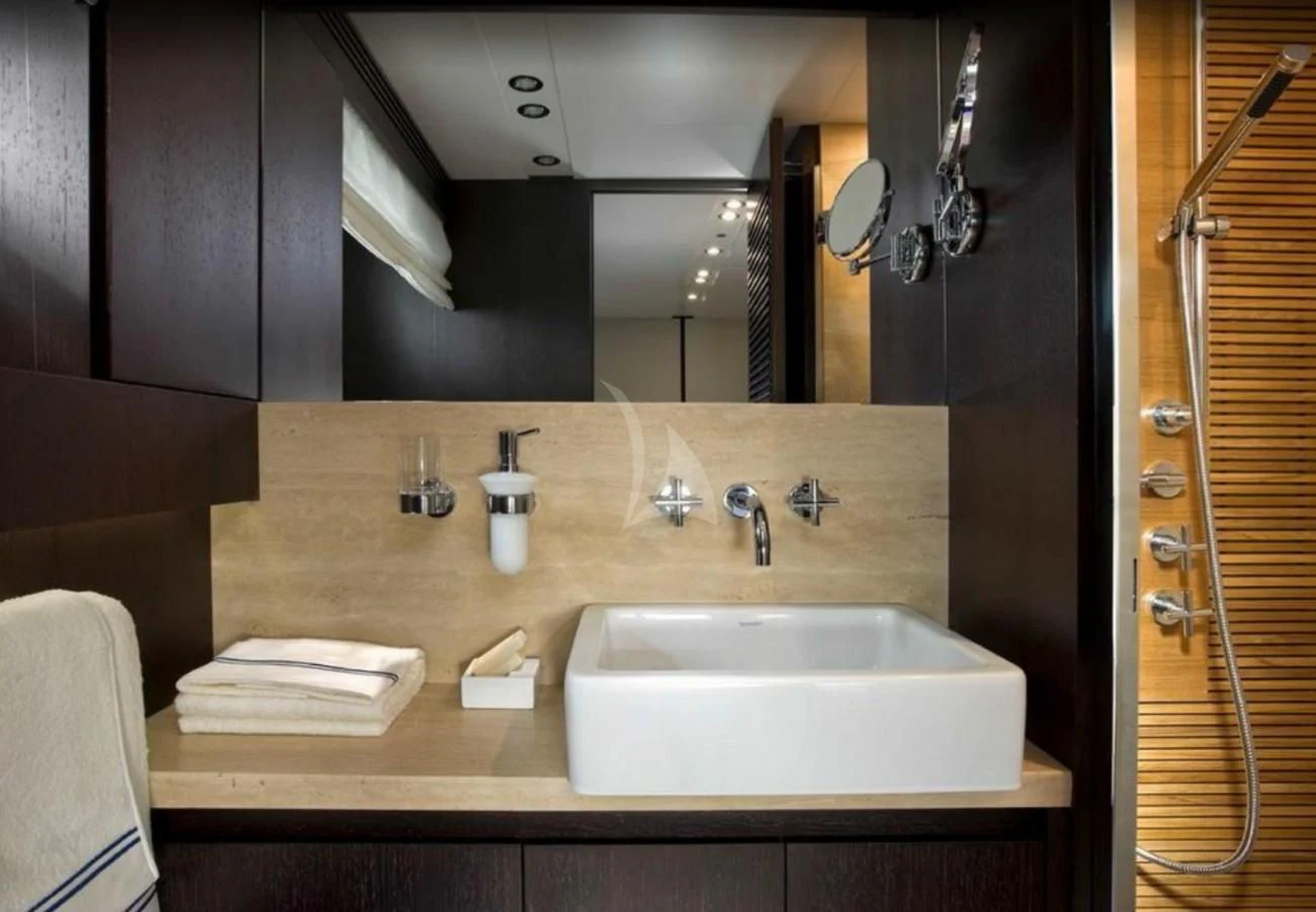 a bathroom with a sink and mirror aboard MIRAVAL Yacht for Charter
