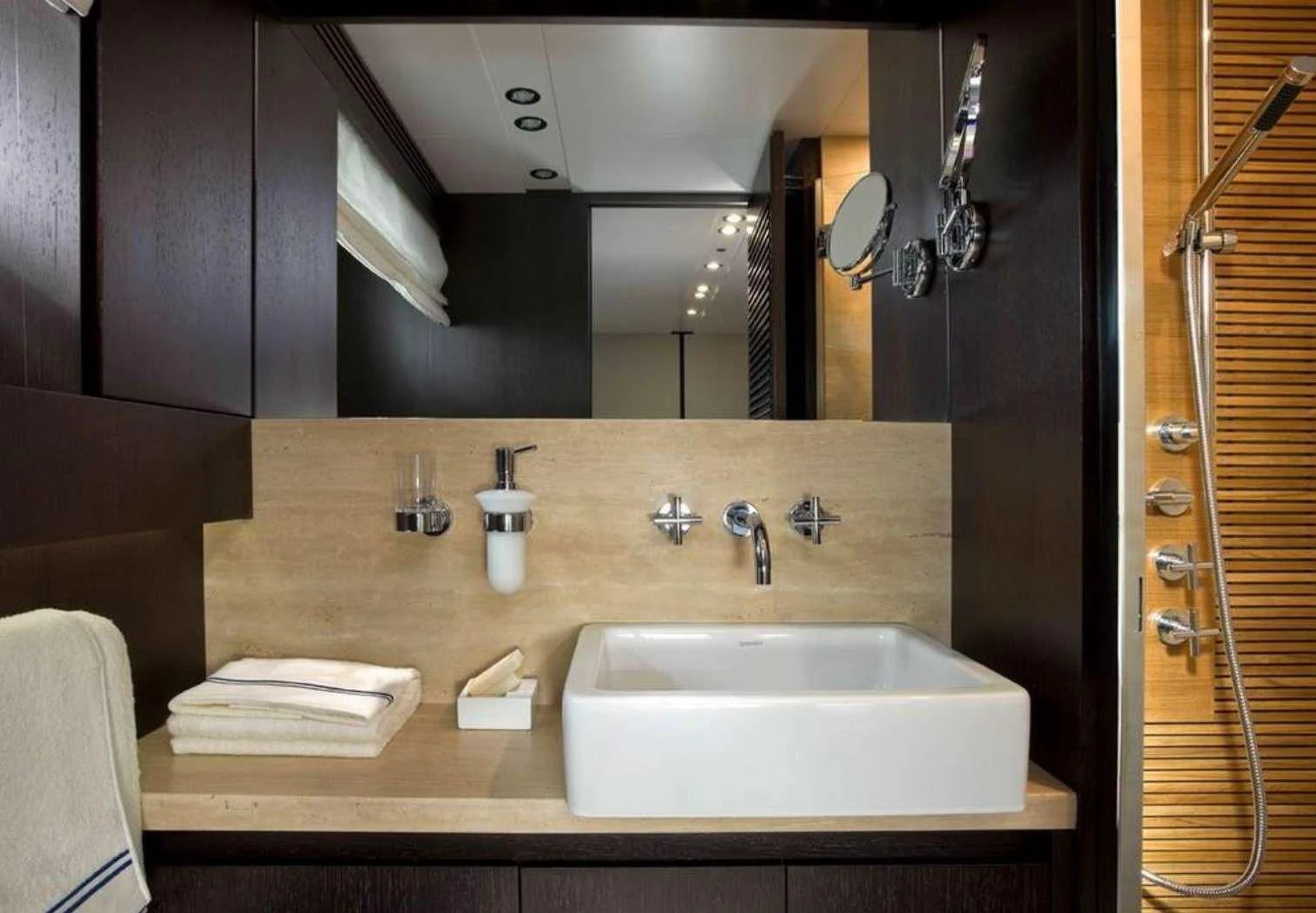 a bathroom with a sink and mirror aboard MIRAVAL Yacht for Charter