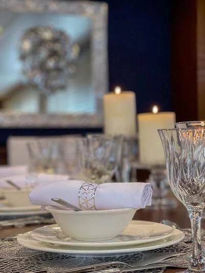 a plate of food and glasses aboard MIRAVAL Yacht for Charter