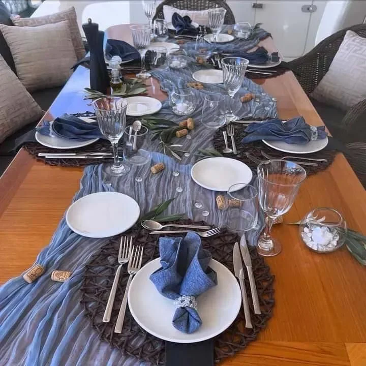 a table with plates and silverware aboard MIRAVAL Yacht for Charter
