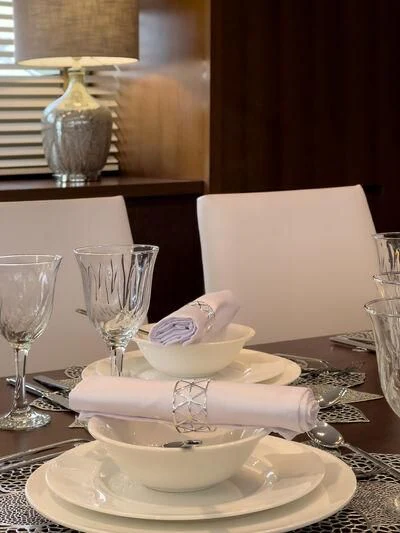 a table with a plate of food and glasses on it aboard MIRAVAL Yacht for Charter