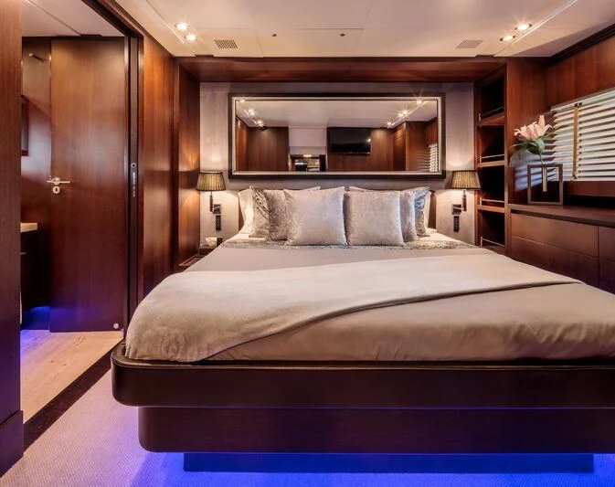 a bed with a white sheet aboard MIRAVAL Yacht for Charter