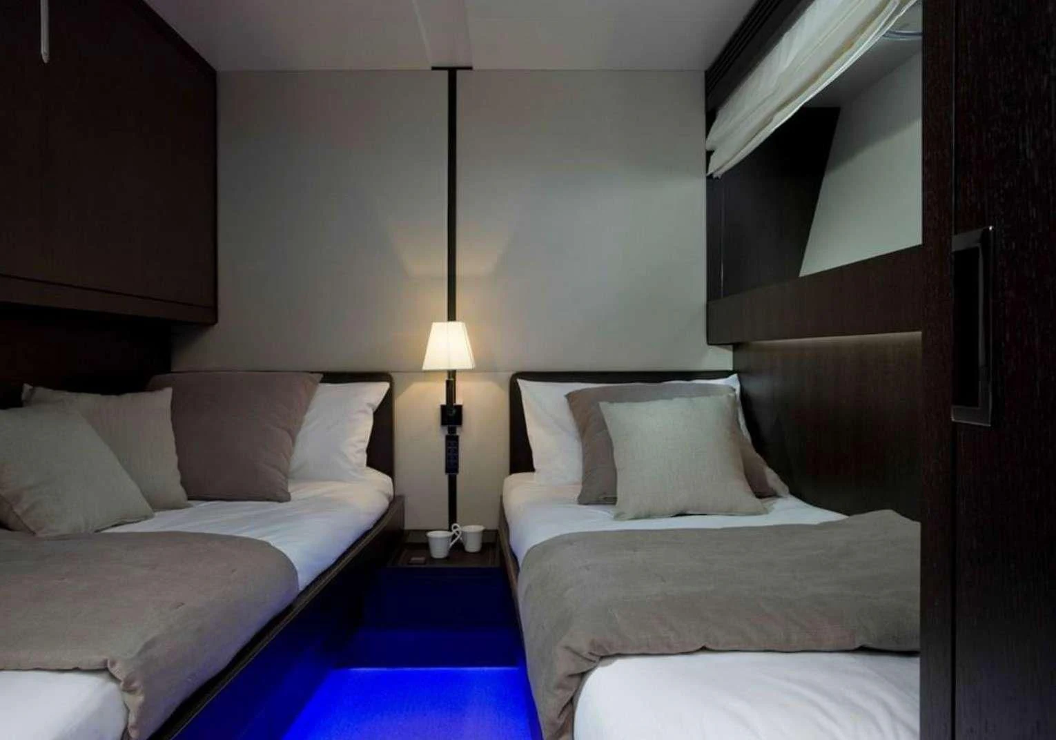 a couple of beds in a hotel room aboard MIRAVAL Yacht for Charter