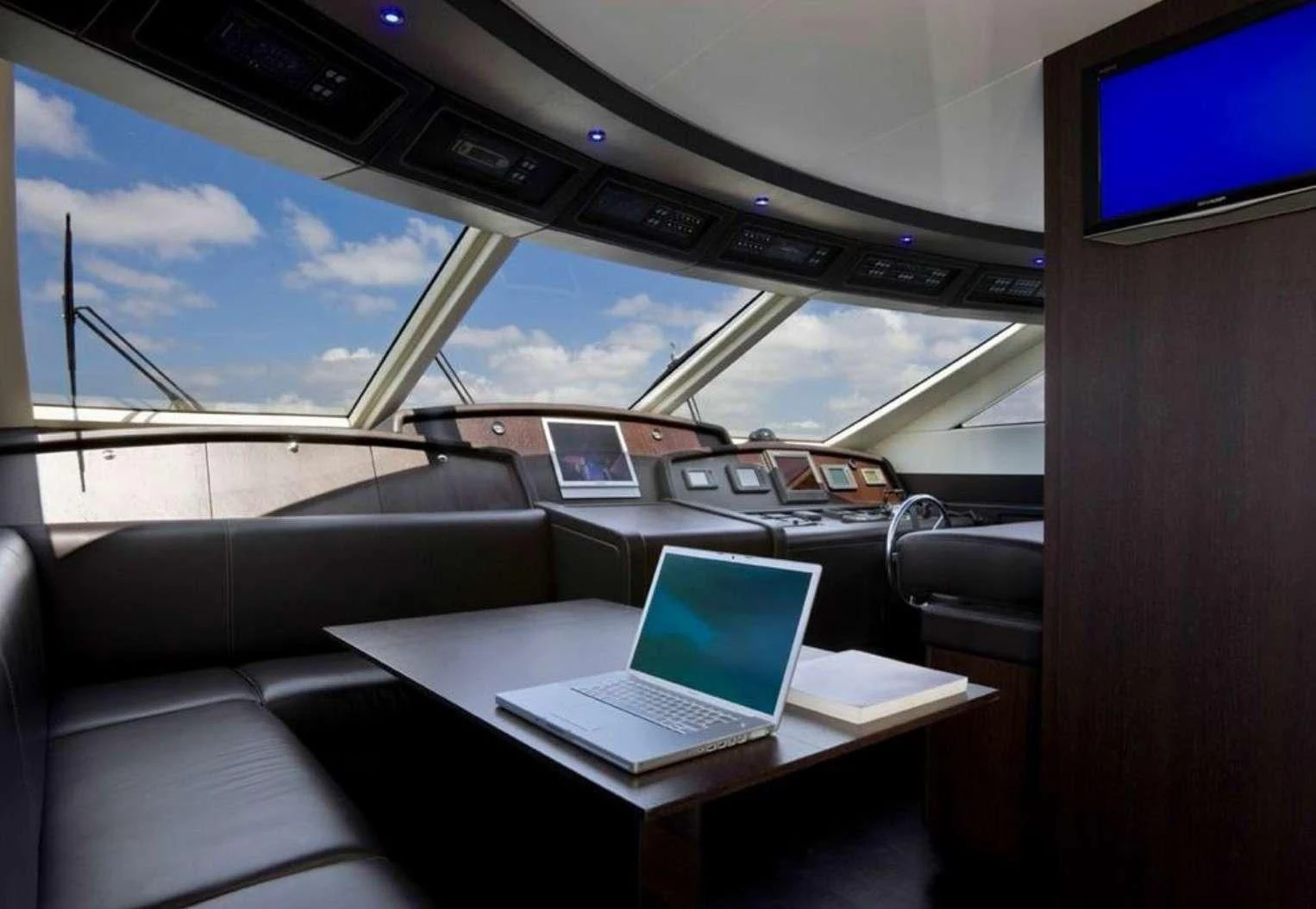 a car with a laptop on it aboard MIRAVAL Yacht for Charter