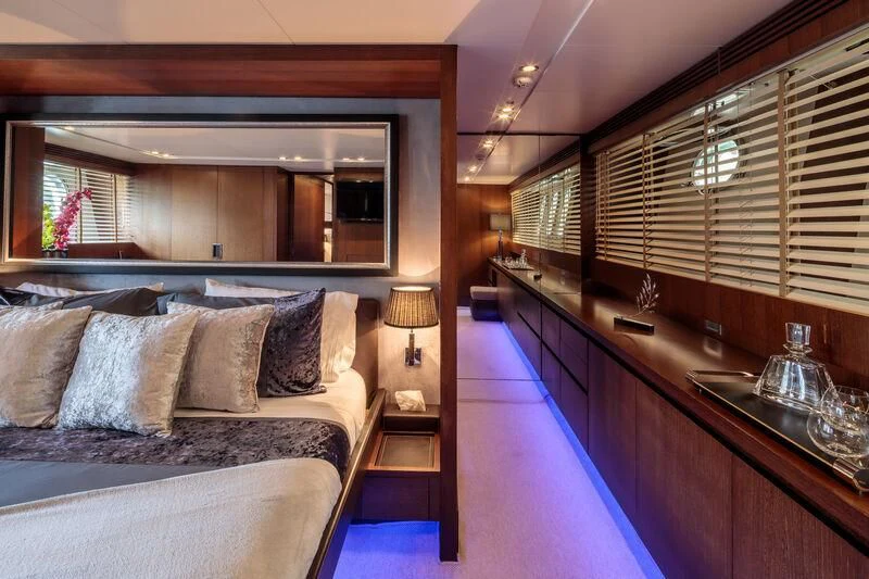 a room with a bed and a sink aboard MIRAVAL Yacht for Charter