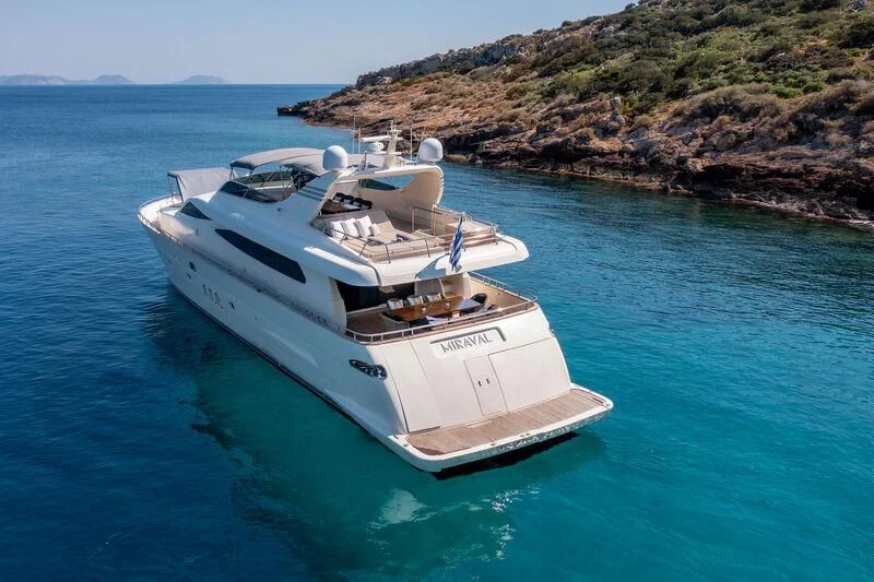 a white boat in the water aboard MIRAVAL Yacht for Charter