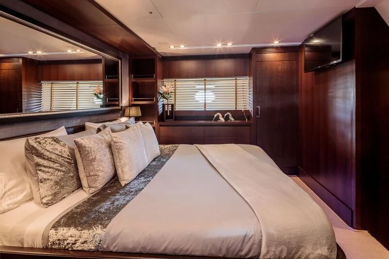 a bed with pillows aboard MIRAVAL Yacht for Charter