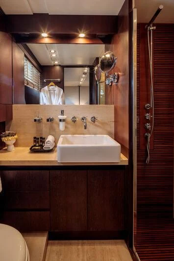 a bathroom with a sink and a mirror aboard MIRAVAL Yacht for Charter