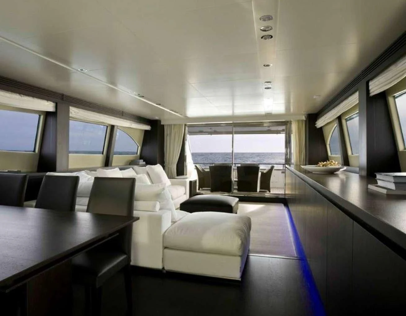 a room with a table and chairs aboard MIRAVAL Yacht for Charter