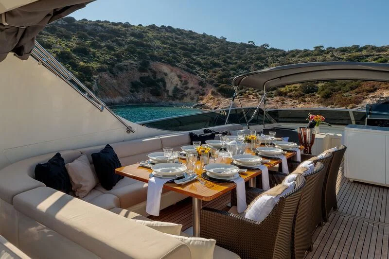 a table set for a meal on a boat aboard MIRAVAL Yacht for Charter