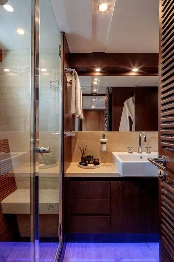 a bathroom with a shower unit and sink aboard MIRAVAL Yacht for Charter