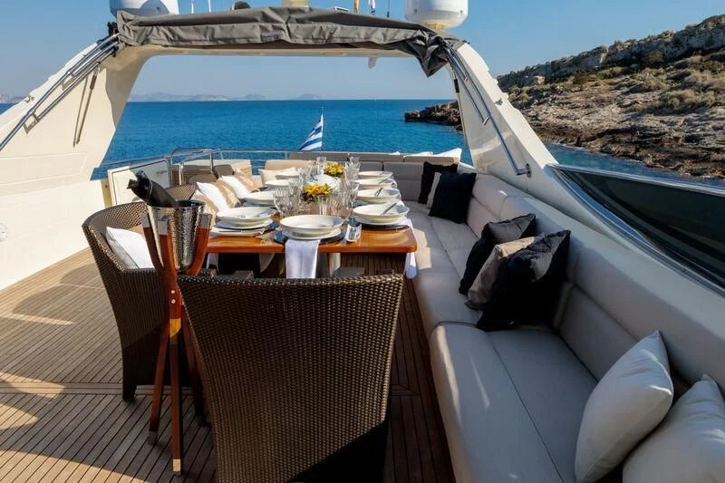 a table set for a meal on a boat aboard MIRAVAL Yacht for Charter
