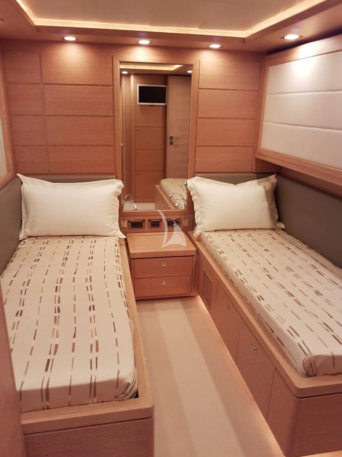 a couple of beds in a room aboard ACCEPTUS Yacht for Sale