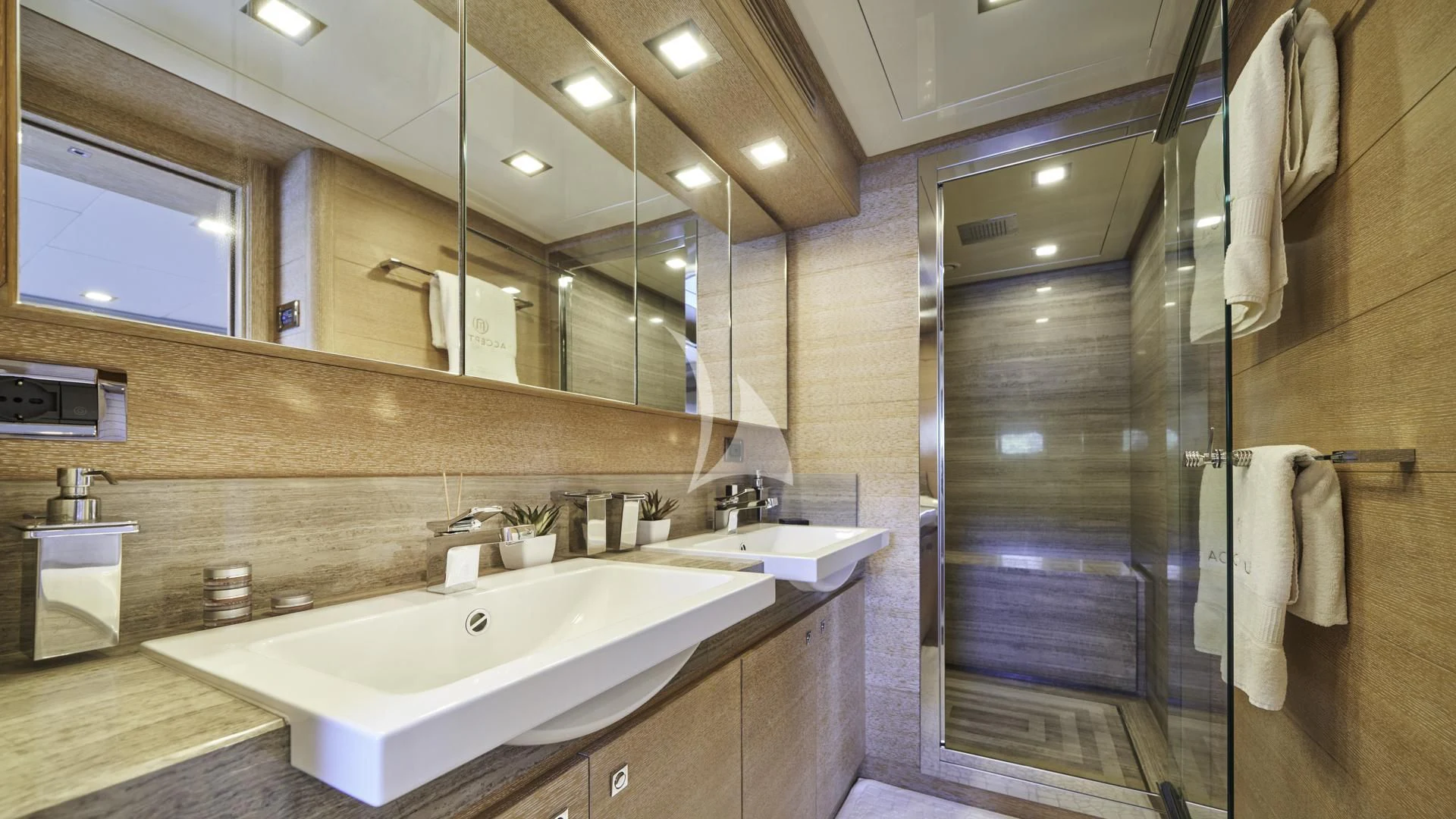 a bathroom with a large glass shower aboard ACCEPTUS Yacht for Sale
