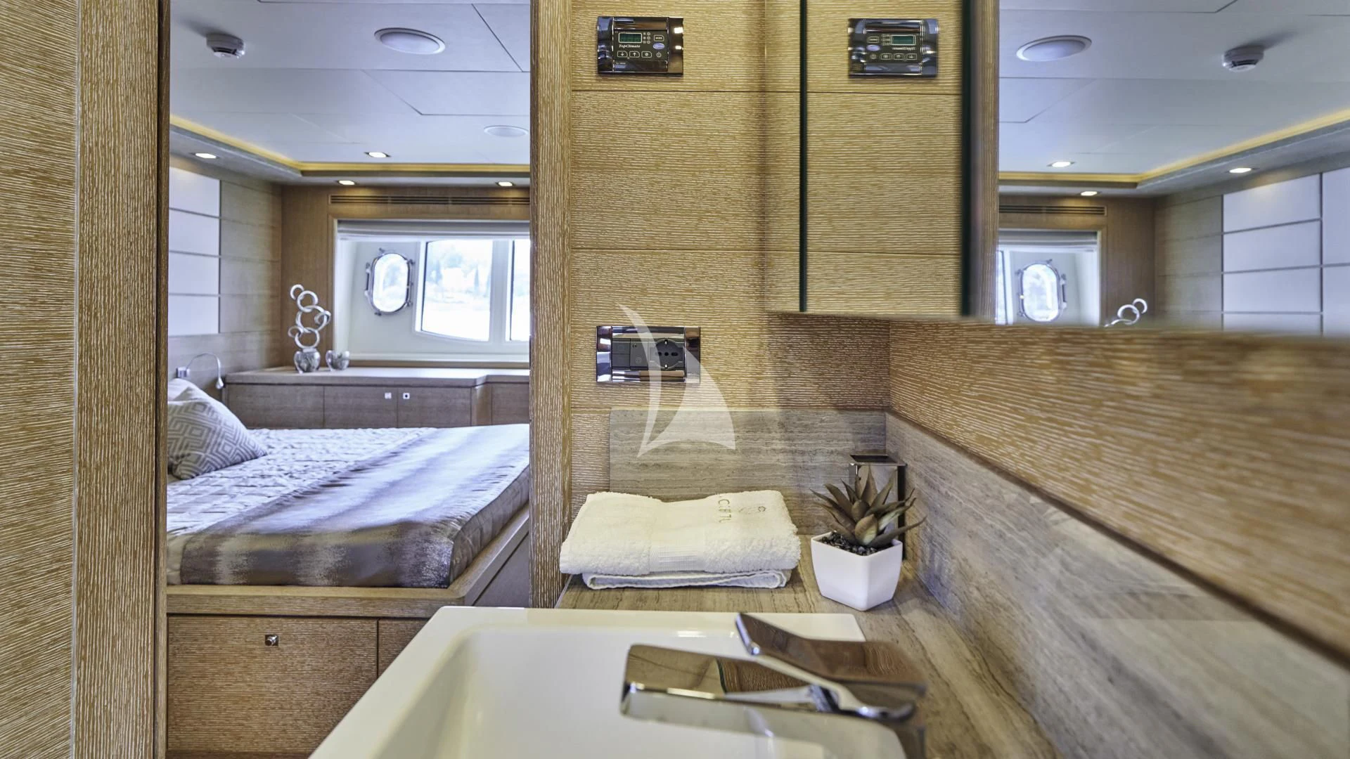 a bathroom with a large mirror aboard ACCEPTUS Yacht for Sale