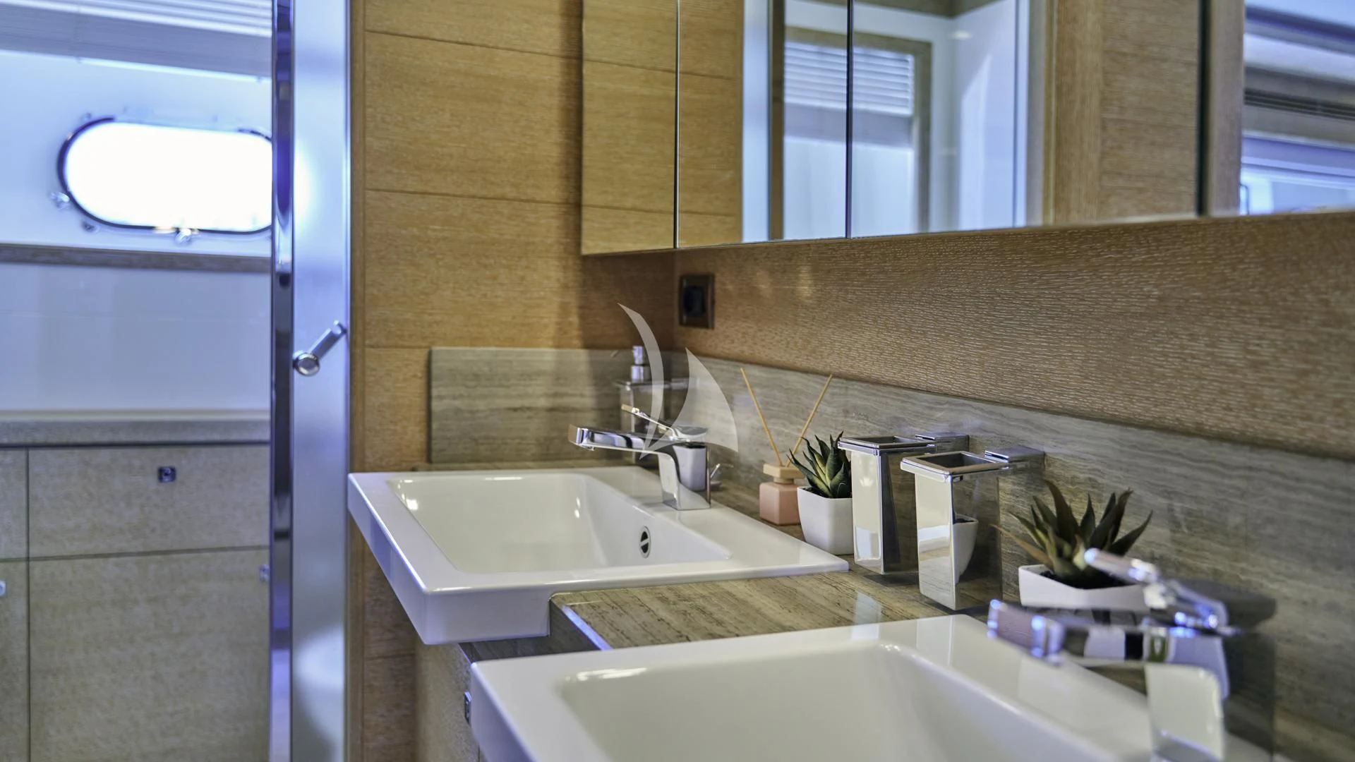 a bathroom with a sink and a mirror aboard ACCEPTUS Yacht for Sale