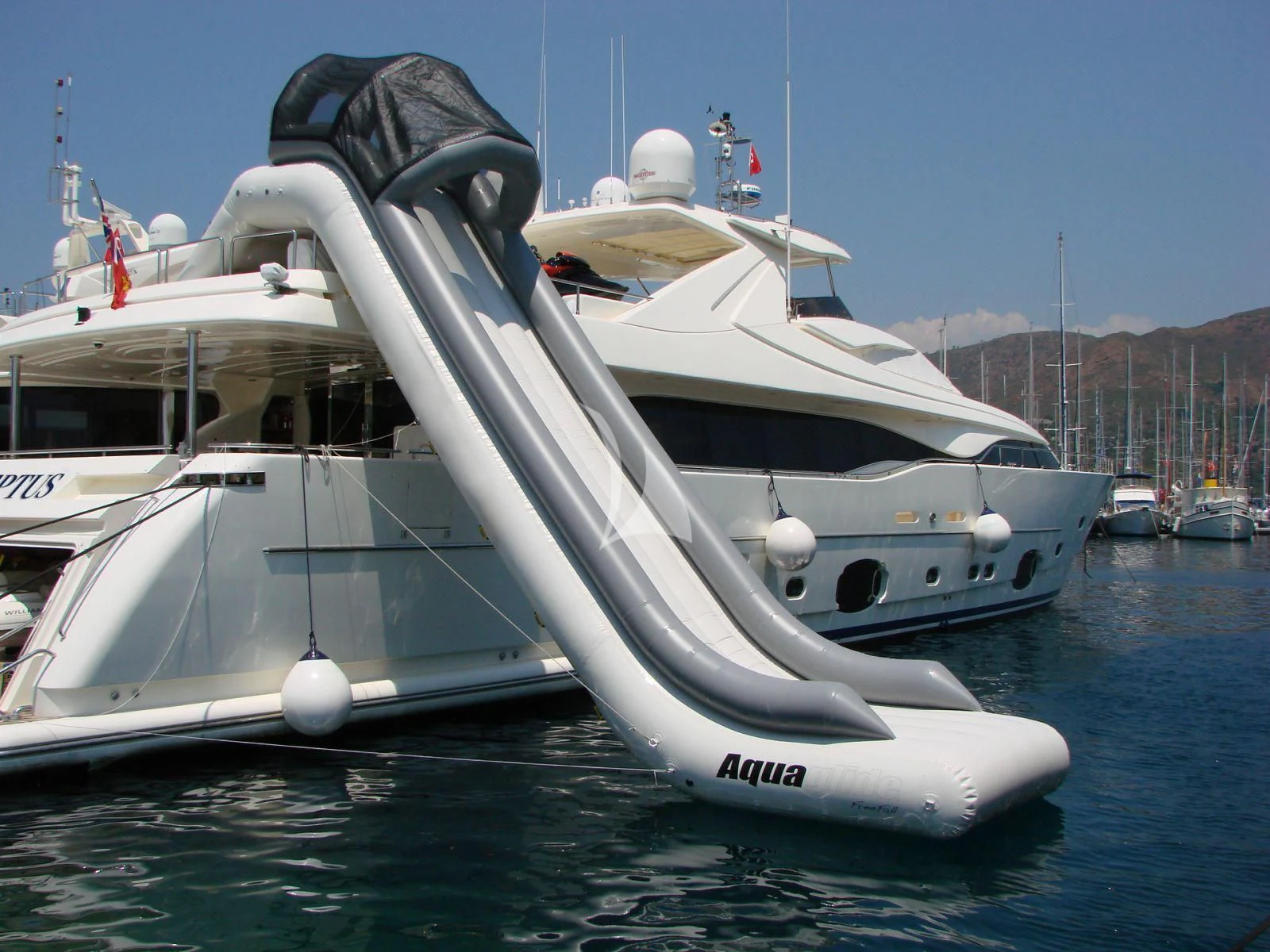 a white boat in the water aboard ACCEPTUS Yacht for Sale