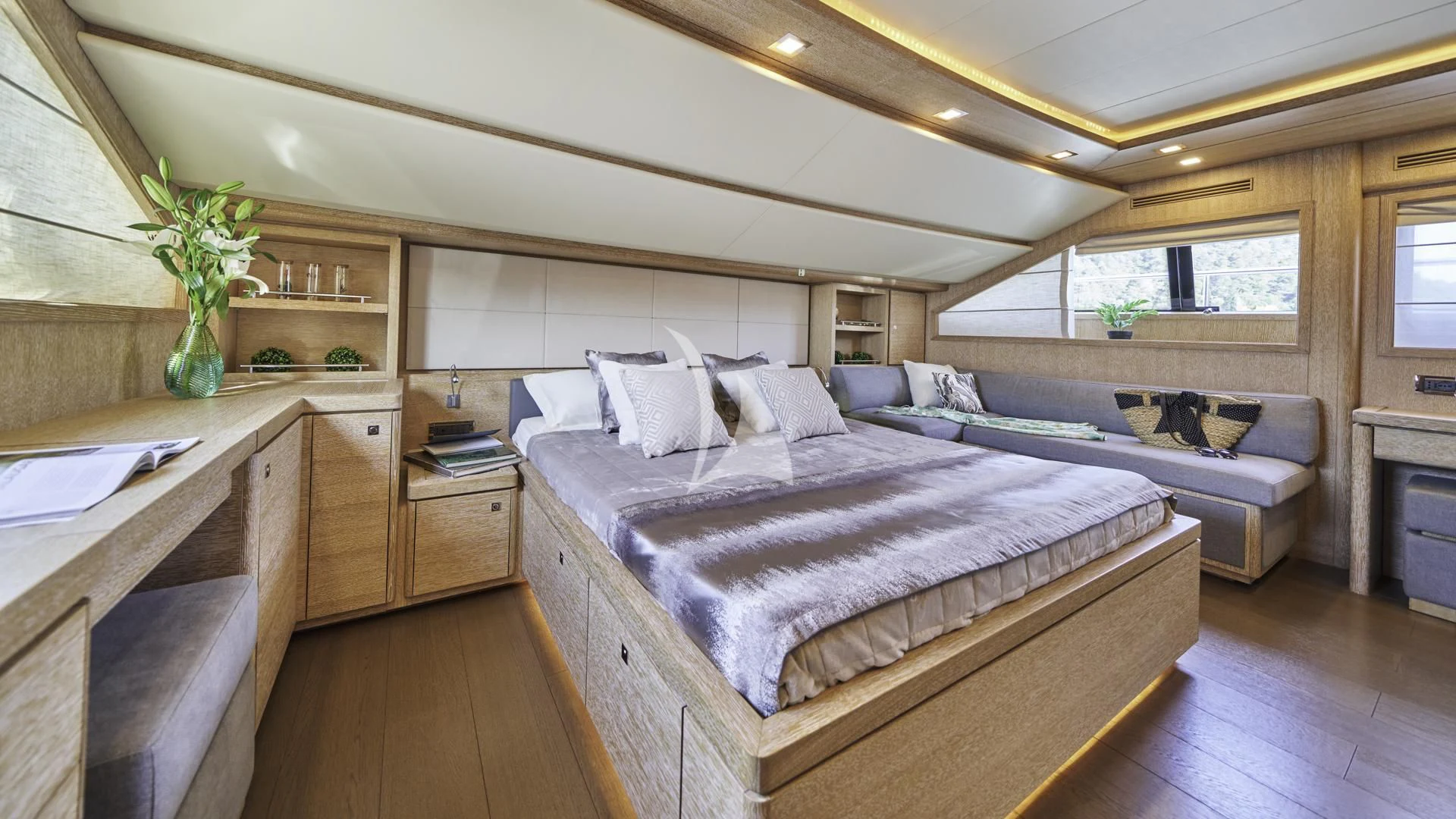 a large bedroom with a large bed aboard ACCEPTUS Yacht for Sale
