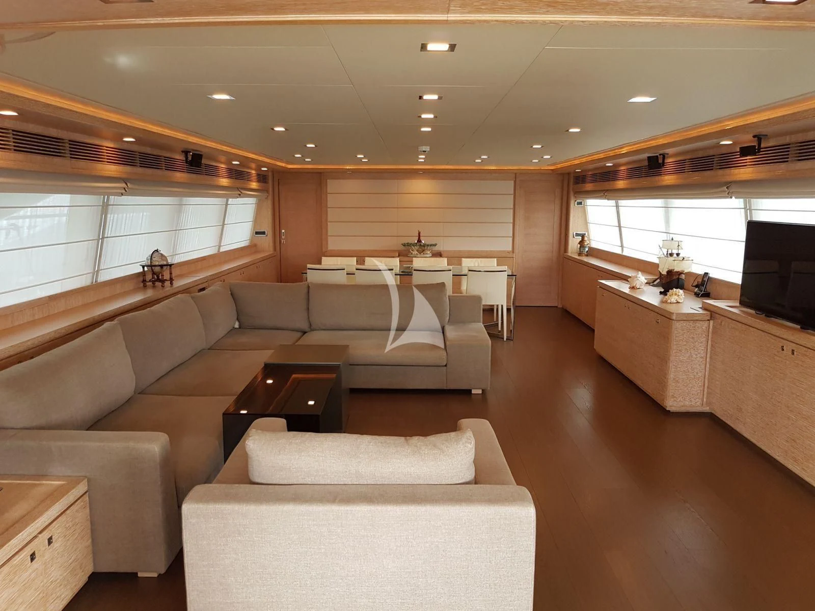a living room with a couch and a table aboard ACCEPTUS Yacht for Sale