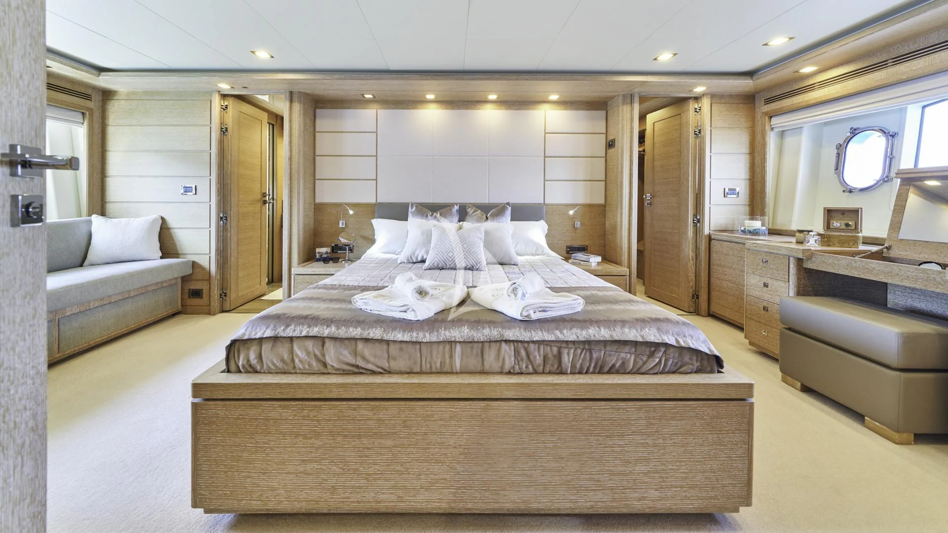 a large bedroom with a bed aboard ACCEPTUS Yacht for Sale