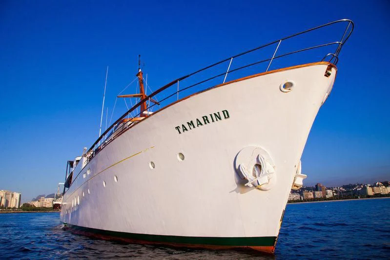 a large white boat on the water aboard TAMARIND Yacht for Sale