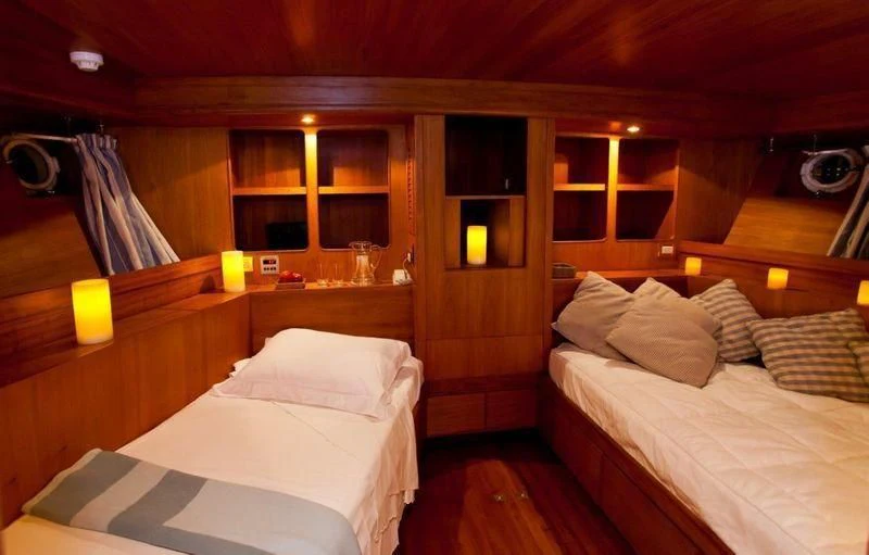a room with two beds aboard TAMARIND Yacht for Sale