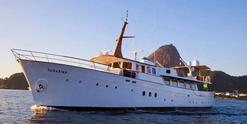 a large boat on the water aboard TAMARIND Yacht for Sale