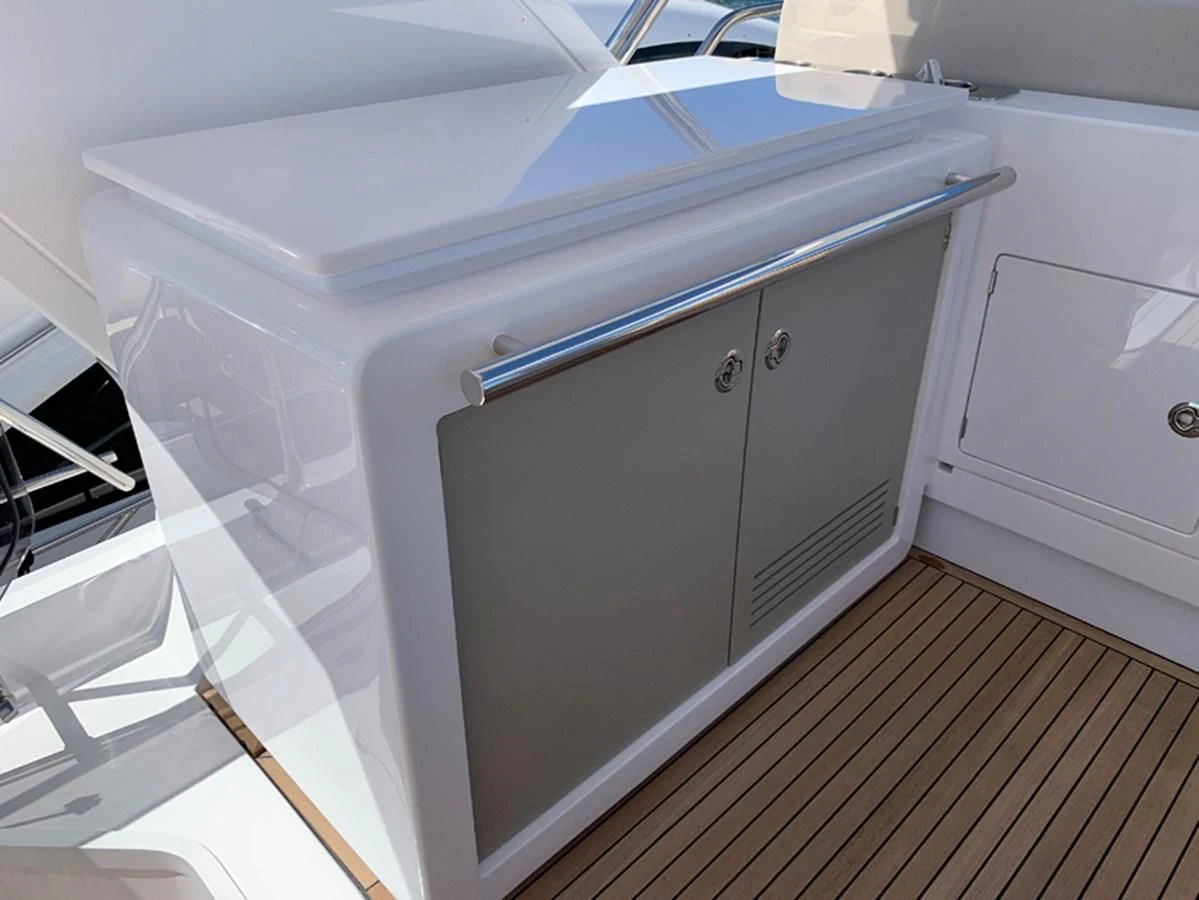 a white kitchen with a large white cabinet aboard IMAGINE Yacht for Sale