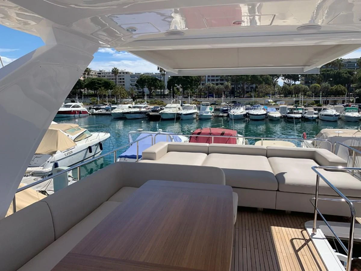 a boat is parked in a harbor aboard IMAGINE Yacht for Sale