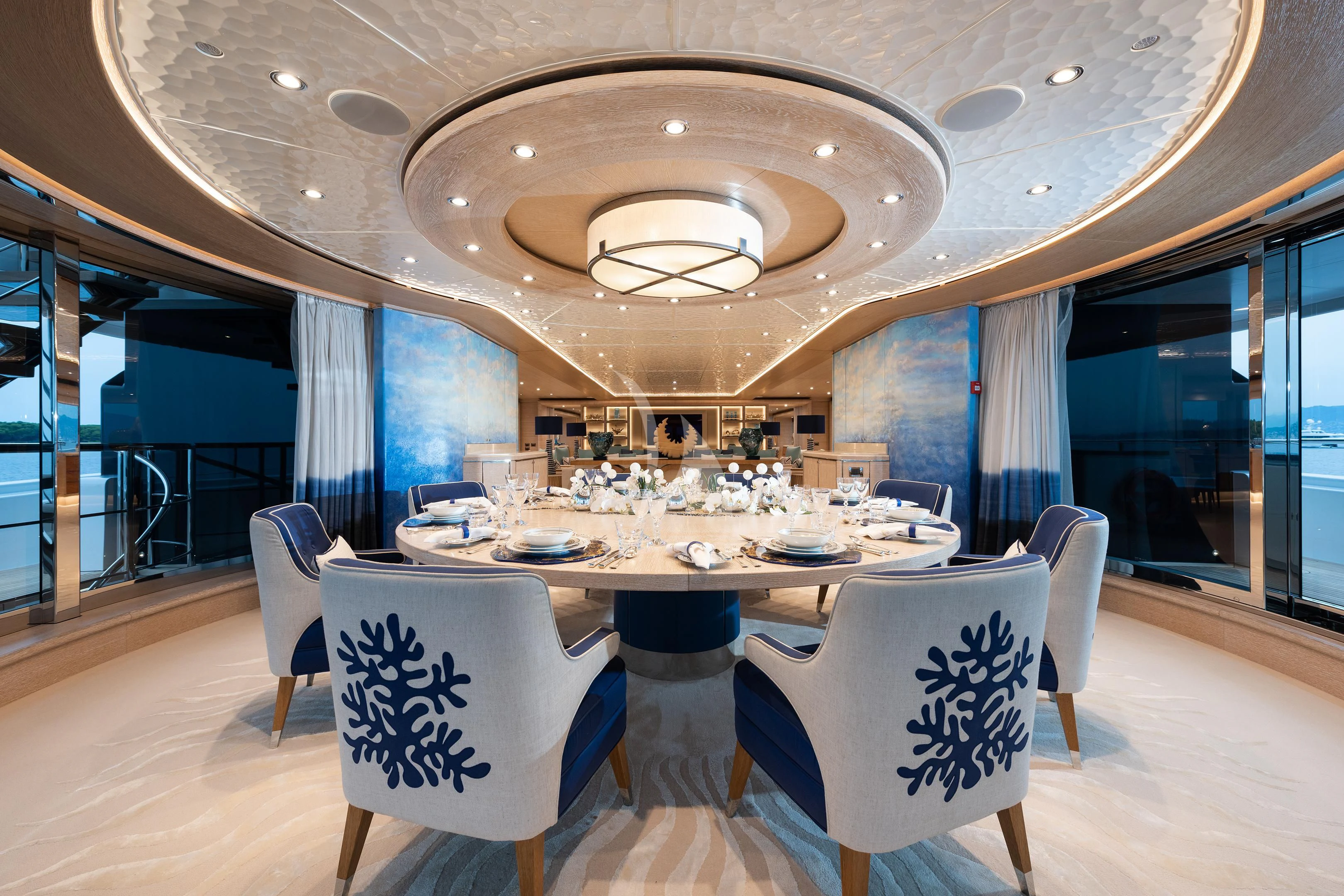 a large dining room with a table and chairs aboard STARBURST IV Yacht for Charter