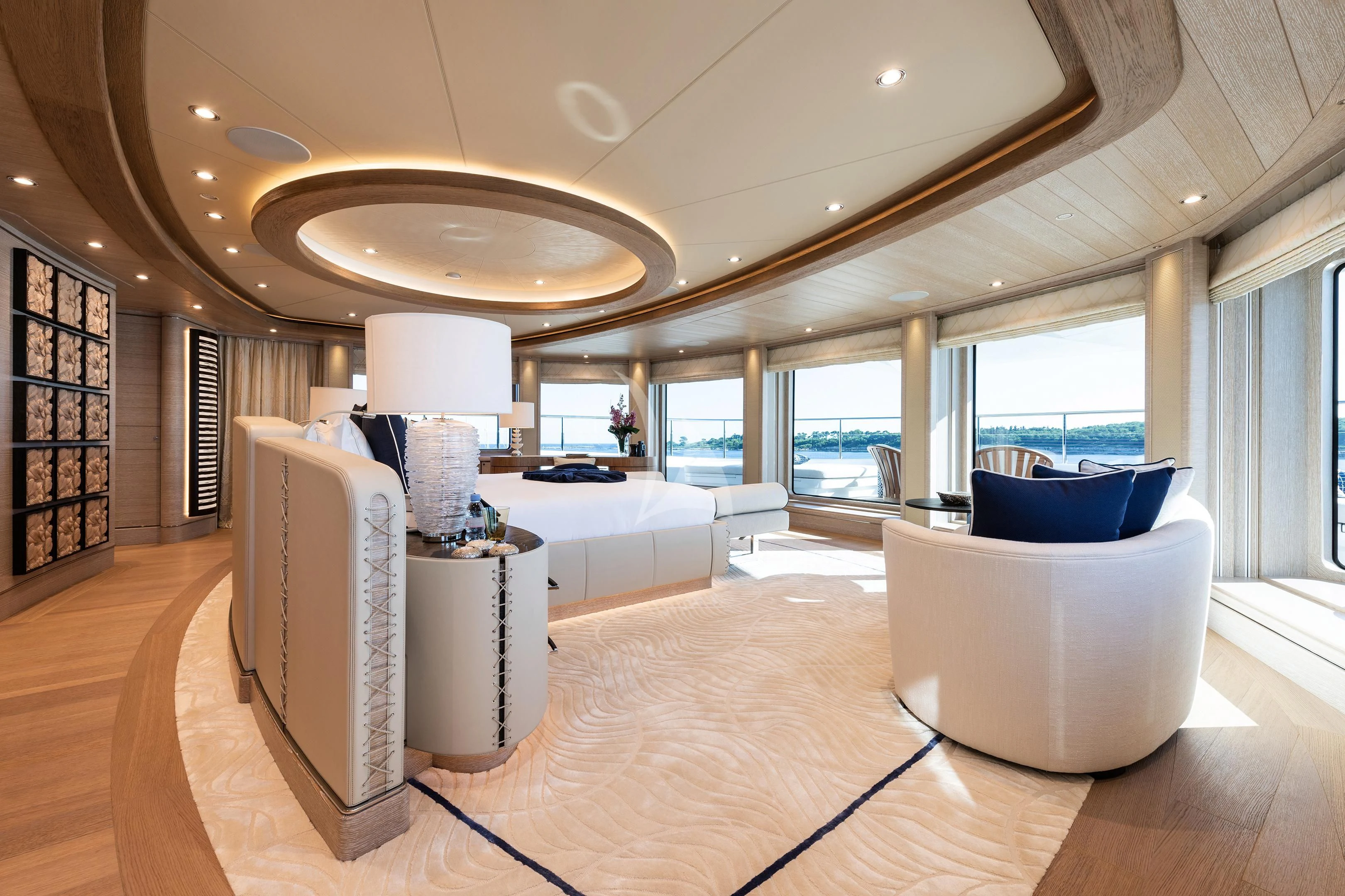a large living room with a large window aboard STARBURST IV Yacht for Charter
