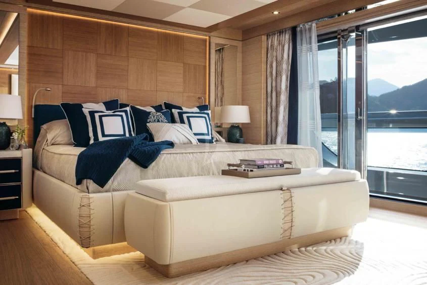 a large bed in a room aboard STARBURST IV Yacht for Charter