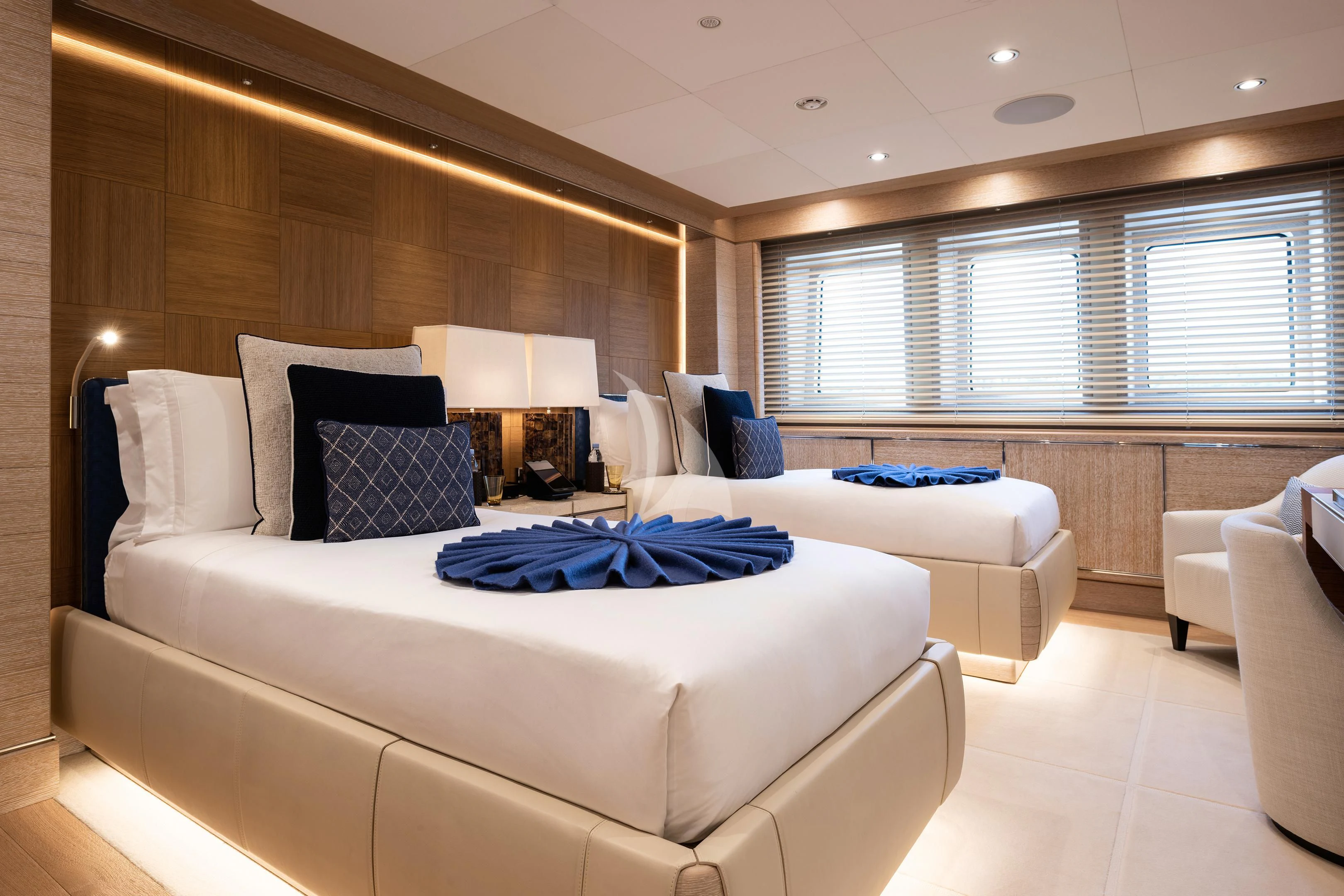 a room with a bed and a couch aboard STARBURST IV Yacht for Charter