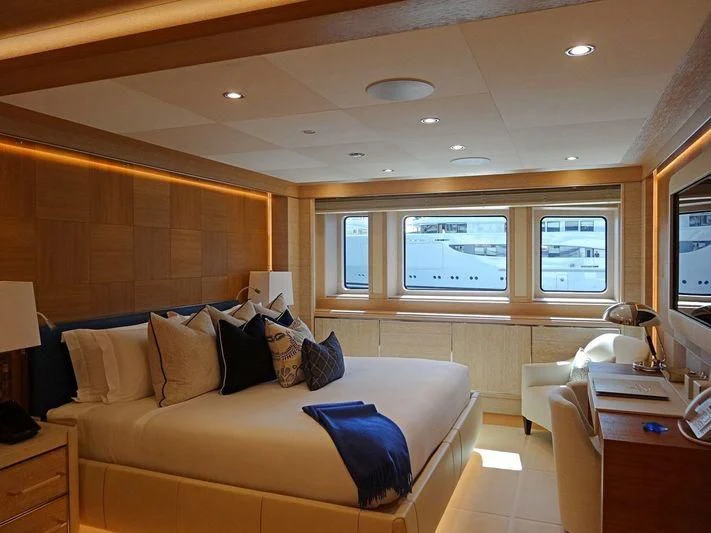 a living room with a couch and a television aboard STARBURST IV Yacht for Charter