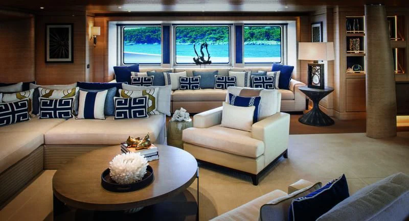 a living room with a couch and a coffee table aboard STARBURST IV Yacht for Charter