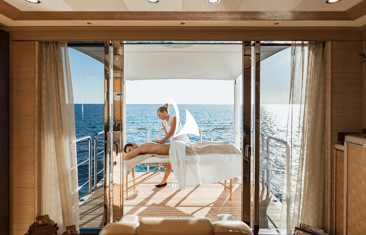 a person sitting on a bed aboard STARBURST IV Yacht for Charter