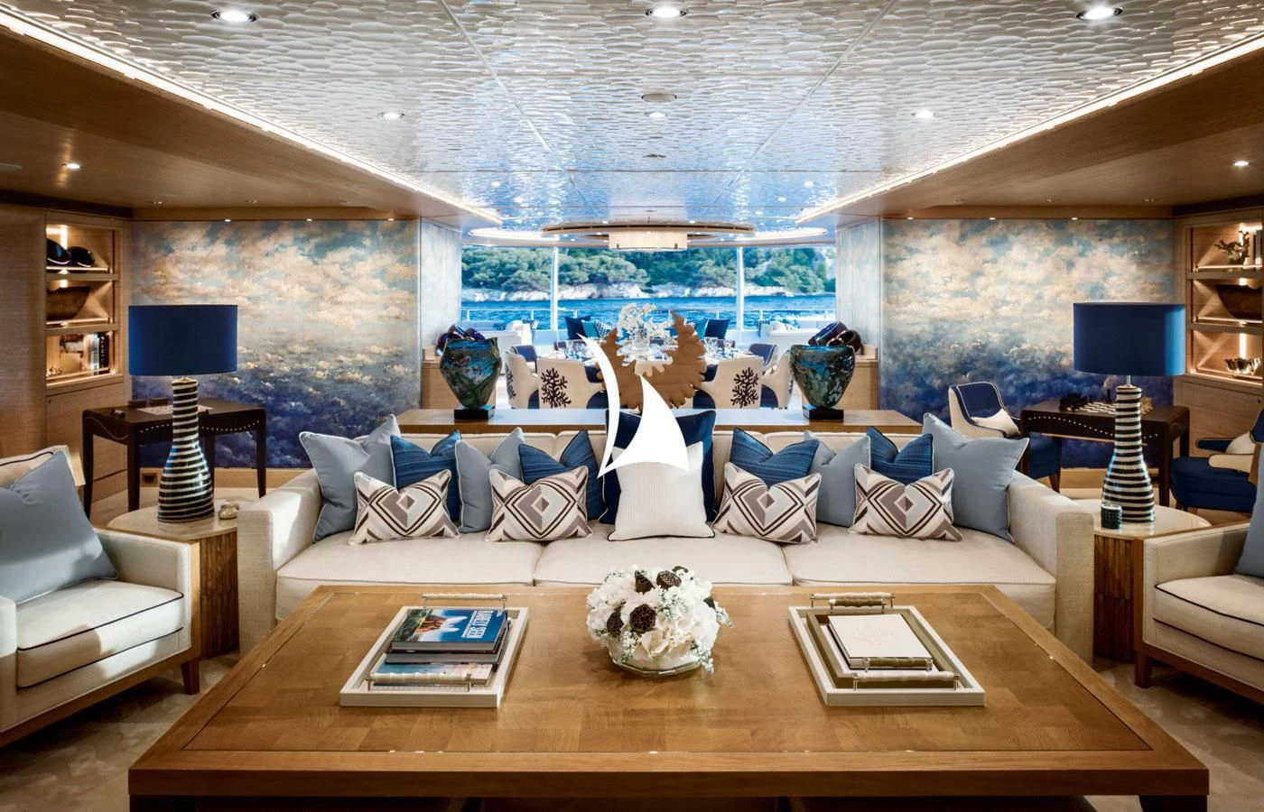 a large living room with a large window aboard STARBURST IV Yacht for Charter