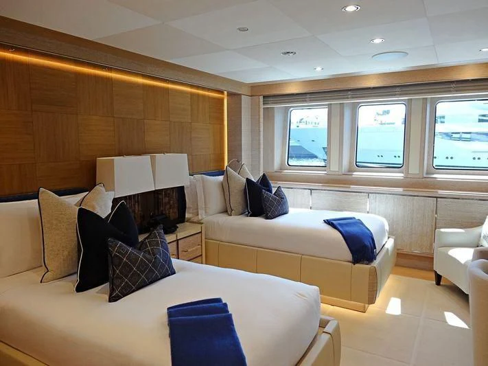 a living room with a couch and a television aboard STARBURST IV Yacht for Charter