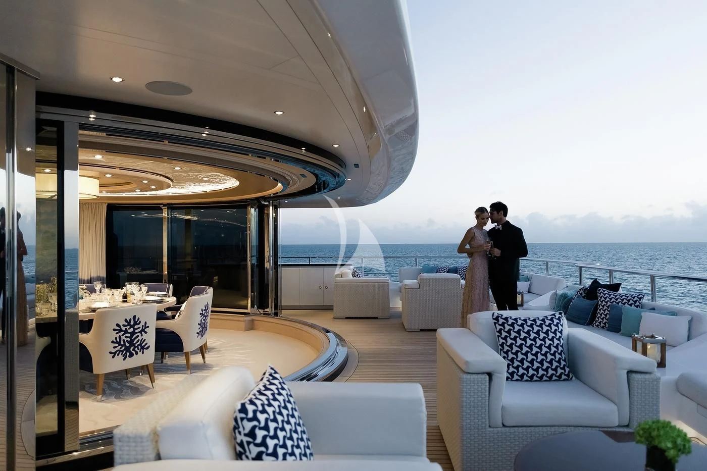 a couple kissing on a balcony aboard STARBURST IV Yacht for Charter